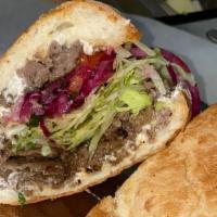 #67 Istanbul · Seasoned ground beef and Gyro meat, tzatziki sauce, red onions, lettuce, and tomatoes