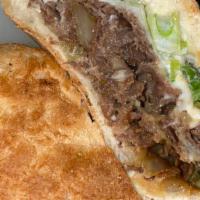#17 Mongolian Beef · Grilled Steak, onions, peppers, topped with mozzarella cheese, green onions,carrots and a to...