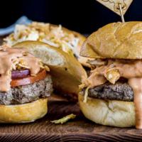 Chimi Burger · A saucy, simply seasoned burger, topped with sauteed cabbage, tomato and onion, the Chimichu...