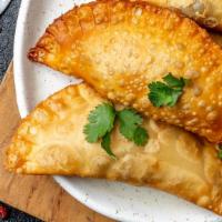Empanada De Queso/Cheese · In shallow pan, heat two teaspoons of oil, add onions, chicken or meat, and the green pepper...