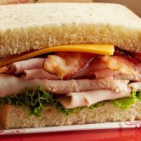 Café Club | Honey Wheat(Classic) · Cured ham, oven-roasted turkey breast, crispy bacon, lettuce, and cheddar cheese with our si...