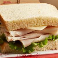Turkey And Swiss | Honey Wheat (Classic) · Oven-roasted turkey breast with swiss cheese, lettuce, and our signature sauce. Cranberry sa...