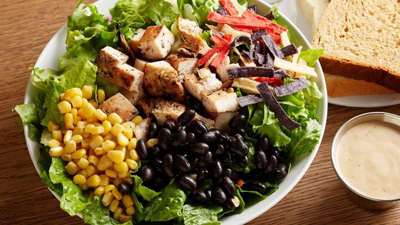 Southwest Chicken · BBQ Ranch. Grilled chicken, corn, black beans, tortilla strips, cheddar cheese, and avocado on top of fresh salad greens.