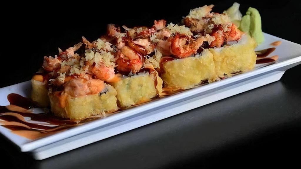 Jailhouse Roll · (FRIED) Shrimp tempura and cream cheese inside, fully fried, then topped with Cajun seasoned crawfish, spicy mayo, eel sauce and crunchy flakes.