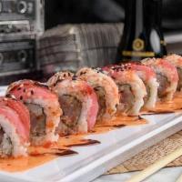 Jam Sesh Roll · Yellowtail, albacore tuna and spicy mayo inside, red tuna and crab stick outside, topped wit...