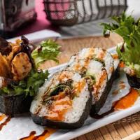 Spider Roll · Soft shell crab tempura, cucumber, avocado, spring mix inside, topped with sweet chili and e...