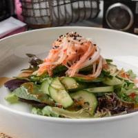 Cucumber Salad · Cucumbers and crab stick glazed with sweet chili and ponzu sauce, piled on spring mix, toppe...