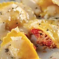 Lobster Ravioli · Type of dumpling filled with lobster baked with homemade alfredo sauce topped with Mozzarell...