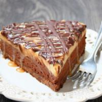 Caramel Peanut Butter · Topped with Snickers candy bars. A heavenly combination of peanut butter mousse, chopped sni...