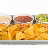 Ultimate Trio · A personal portion of our house-made salsa, classic queso, guacamole, and our magic seasonin...