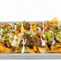 Ultimate Nachos · Refried black beans, house-made queso, sautéed onions and peppers, guacamole, pico de gallo,...