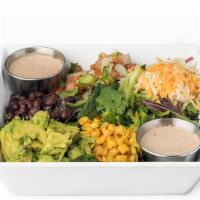 Mexican Cobb Salad · Salad greens, black beans, roasted corn, avocado, pico de gallo, cheddar-jack cheese, your c...