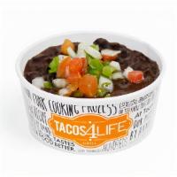 Seasoned Black Beans · Slow simmered and seasoned in-house, topped with pico de gallo.