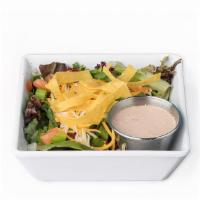 House Salad · Salad greens, black beans, pico de gallo, green onion, cheddar-jack cheese, tortilla strips.