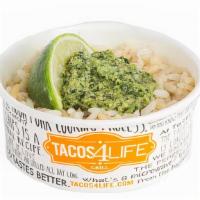 Cilantro Pesto Rice · Steamed rice topped with cilantro, pumpkin seed, garlic, olive oil, and green onion pesto an...