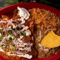 Chilaquiles · Tortilla strips, mixed with scrambled eggs, topped with melted cheese.
