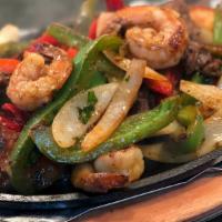 Shrimp Fajita · Shrimp grilled with bell pepper and onions, topped with lettuce and tomato.