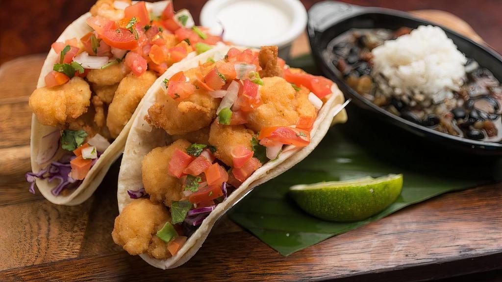 Shrimp Tacos · Grilled, blackened, or fried shrimp, red cabbage, pico de gallo, jalapeno ranch dressing, white rice & black beans. Grilled and blackened shrimp taco can be prepared gluten free.