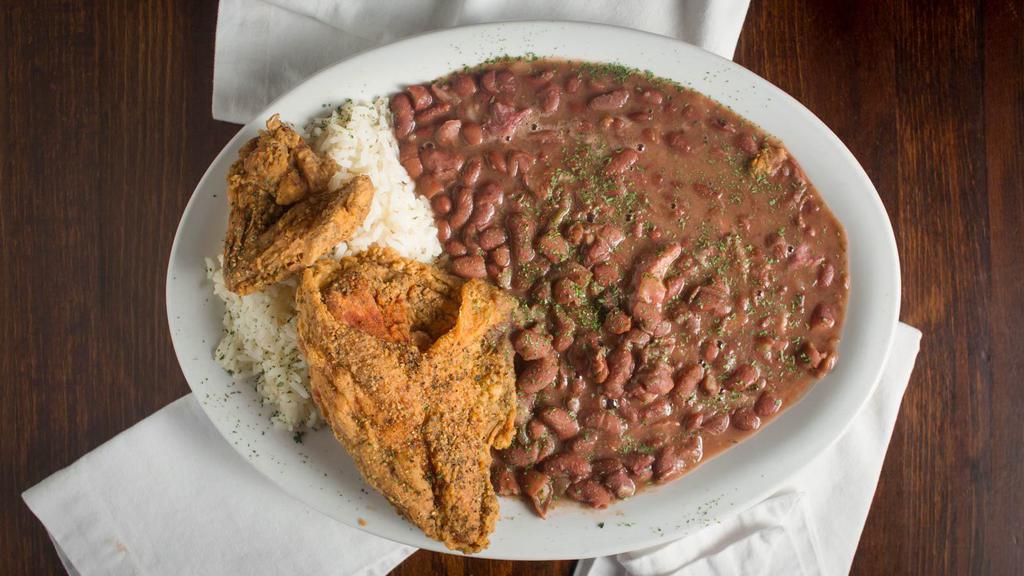 Red Beans · Our slow-cooked red beans served with white rice with your choice of fried chicken, grilled pork chops or hot sausage