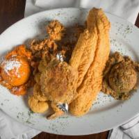 Seafood Platter · Farm raised fish, Gulf shrimp and oysters along with stuffed crab, served with any two sides