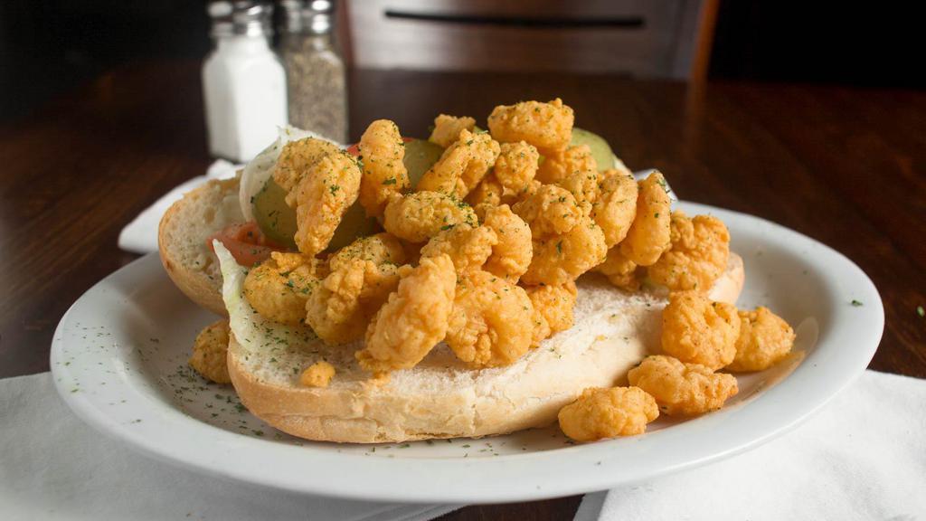 Shrimp Poboy · Fried shrimp, mayonnaise, lettuce, tomato and pickle on a toasted French bun