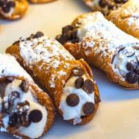 Cannoli · Italian pastry shell filled with sweetened ricotta cheese & chocolate bits.