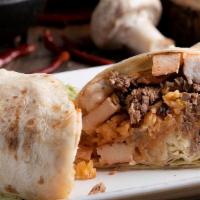 Sp Burrito Bandera · One burrito with steak or grilled chicken. Topped with cheese dip and covered with red and g...