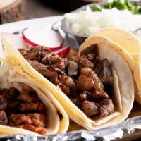 Street Tacos (Three) · Served with corn tortilla, comes with a side of onions, radishes, cilantro, and limes