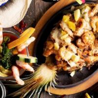Camarones Hawaiianos · Sautéed shrimp with onions, pineapples, and zucchini mixed all with creamy sauce. Served wit...