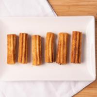 Churros · Pastry sticks rolled in cinnamon and sugar.