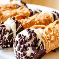 Cannoli · Delicate, fried pastry dough tubes, filled with sweet, creamy ricotta and a dusting of powde...