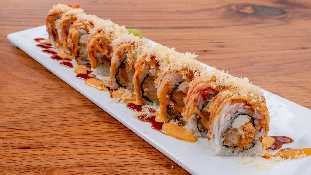 Batman Roll · Shrimp tempura, cream cheese, spicy crawfish, topped with crab stick, crunchy, eel sauce, spicy mayo.