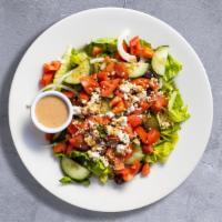 Greek Salad · Romaine lettuce with English cucumbers, red onions, kalamata olives, cherry tomatoes, feta c...