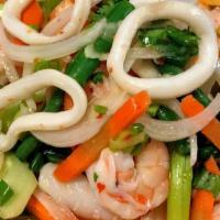 Squid Salad · Steamed squid with cherry tomato, onion, sliced cucumber, scallion, and cilantro in spicy li...
