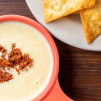 Buffalo White Cheese Dip · Blanco queso and chorizo served with flour chips.