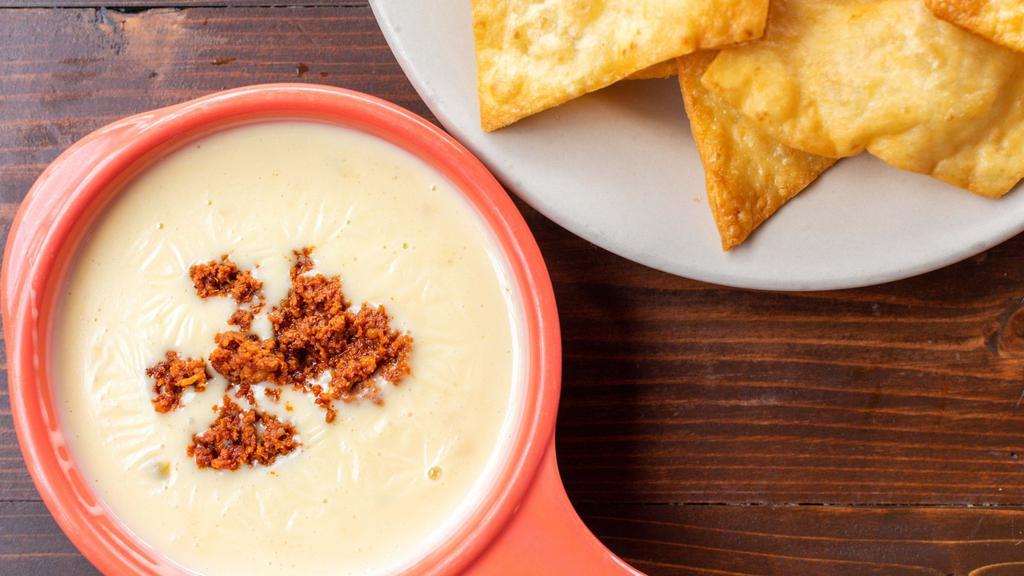 Buffalo White Cheese Dip · Blanco queso and chorizo served with flour chips.