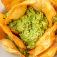Guacamole · Our fresh avocado dip served with flour chips.