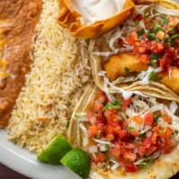 Cabo Tacos · Two white fish tacos grilled or tempura fried and topped with baja sauce, shredded cabbage a...