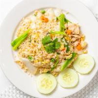 Thai Fried Rice  · Stir fried Jasmine rice cooked with garlic, egg, onion, peas, carrots, corns and scallions