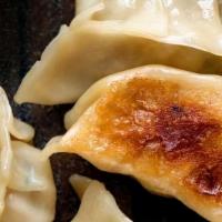 Steamed Pork Dumplings (6) · W/ ginger garlic soy sauce