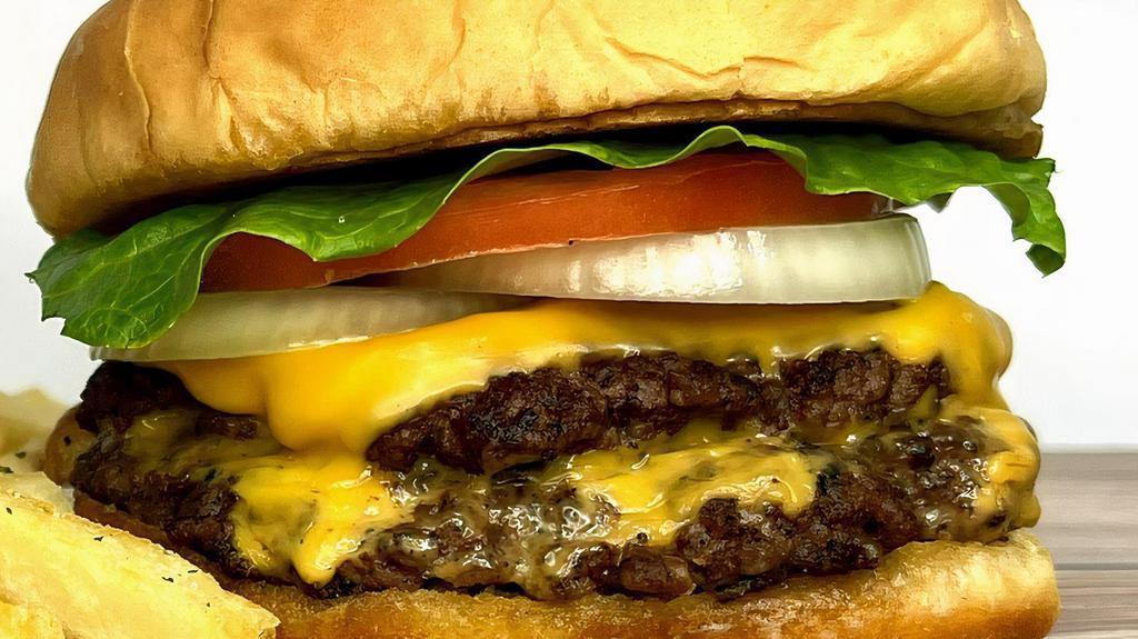 Smash Burger · Two slices of melted American cheese between two Angus beef patties cooked- to- order,
sandwiched between a buttered bun
