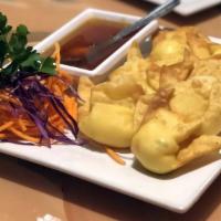 Crab Wontons · Wontons with crab meat, cream cheese, red onions, scallions, carrots served w. Sweet and sou...