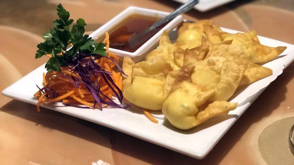 Crab Wontons · Wontons with crab meat, cream cheese, red onions, scallions, carrots served w. Sweet and sour sauce.
