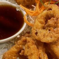 Calamari · Sliced calamari rings lightly battered served with sweet and sour sauce.