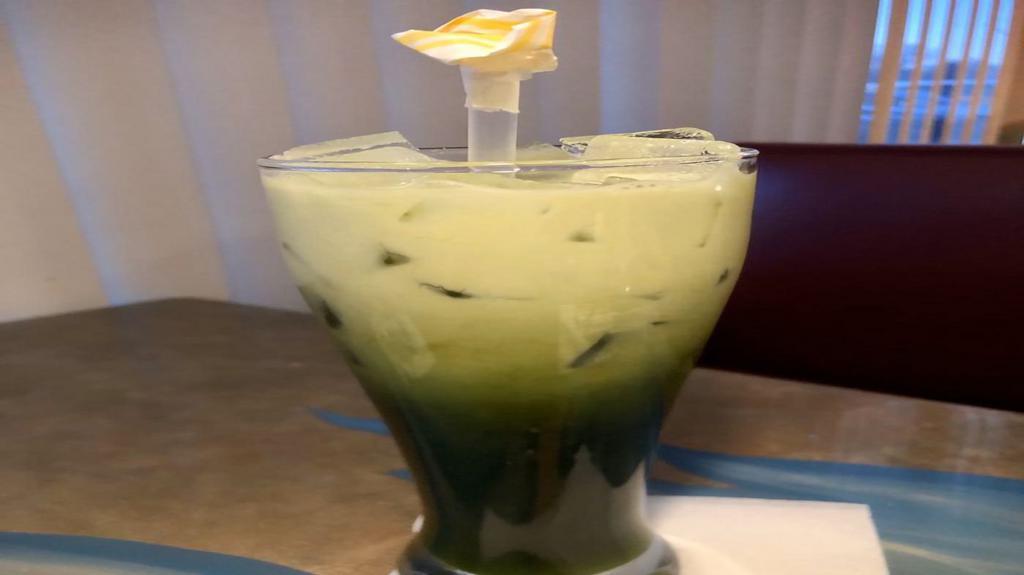 Thai Green Tea · Freshly brewed, fragrant, Thai Green Tea with floral notes of sweet scented jasmine & the freshness of mint. Topped with cream over ice.