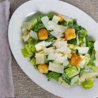 Classic Caesar Salad · Crisp romaine lettuce, Parmesan cheese, and crunchy croutons. Served with caesar dressing on...