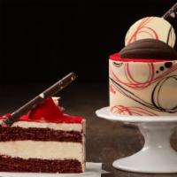 Red Velvet Cake · Red velvet cake layered with cream cheese icing.  Finished with velvety cocoa butter and top...