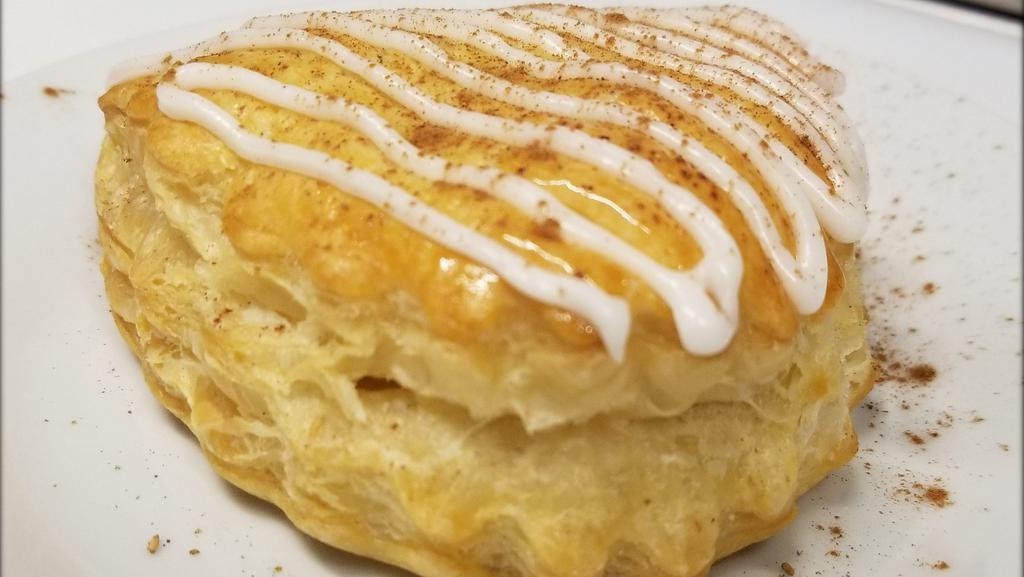 Apple Turnover · Our apple turnovers are made in France, shipped frozen and baked fresh on-site.  Flaky and delicious, a must try!