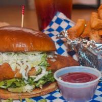 Fish Sandwich · Flounder, Trout, or Catfish with slaw, tartar sauce, lettuce. Choice of one side
