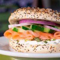 Smoked Salmon Sandwich · Everything bagel, cucumber-dill cream cheese, smoked salmon, capers, cucumber & red onion.